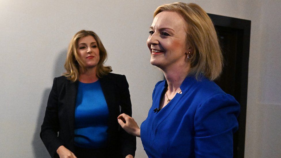Penny Mordaunt greets Conservative leadership candidate Liz Truss during a hustings event