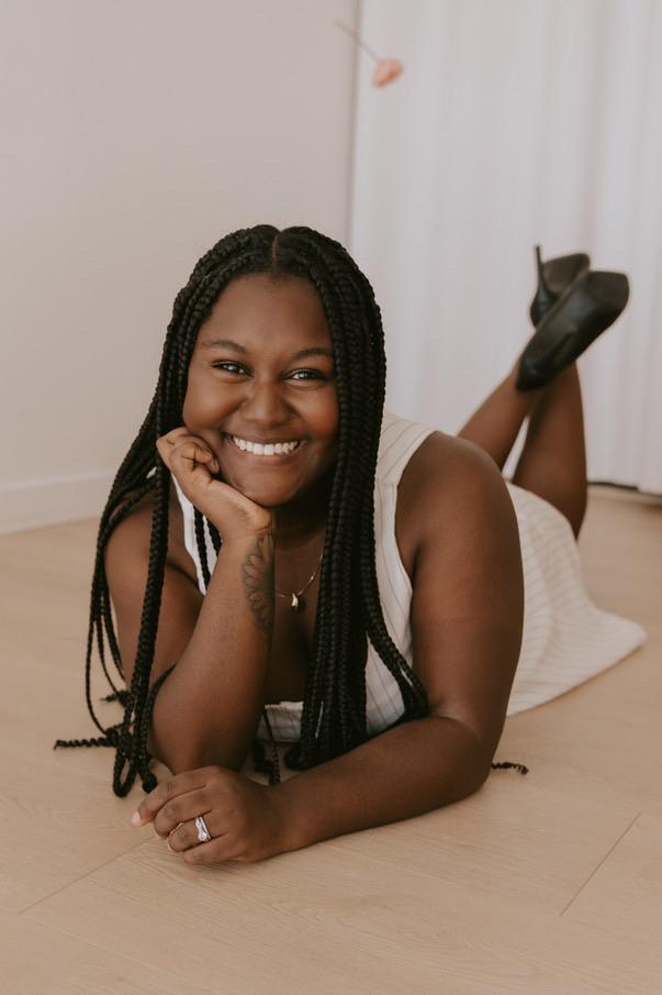 Ezhana Graff laying down, smiling on Feb. 18, 2025.